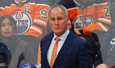 Edmonton Oilers assistant coach Paul Coffey looks on from the bench